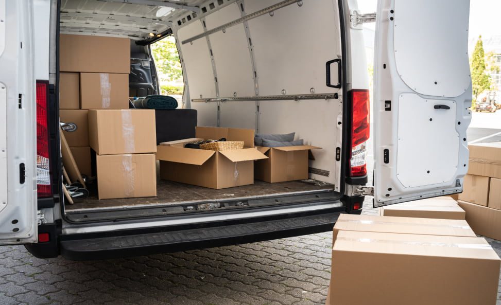 boxes in a van filled with household waste