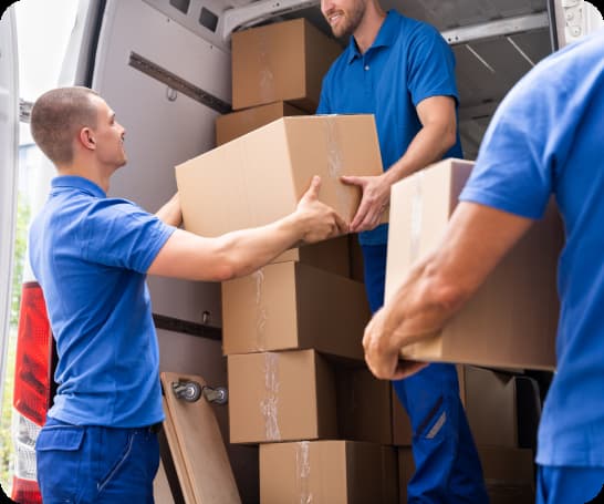 3 men loading a van with cardboard boxes full of items from a house clearance