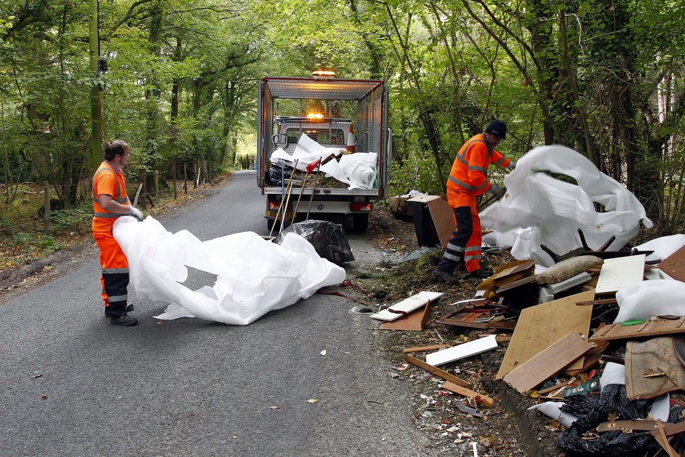 unqualified people after house clearance dumping furniture on the side of a road