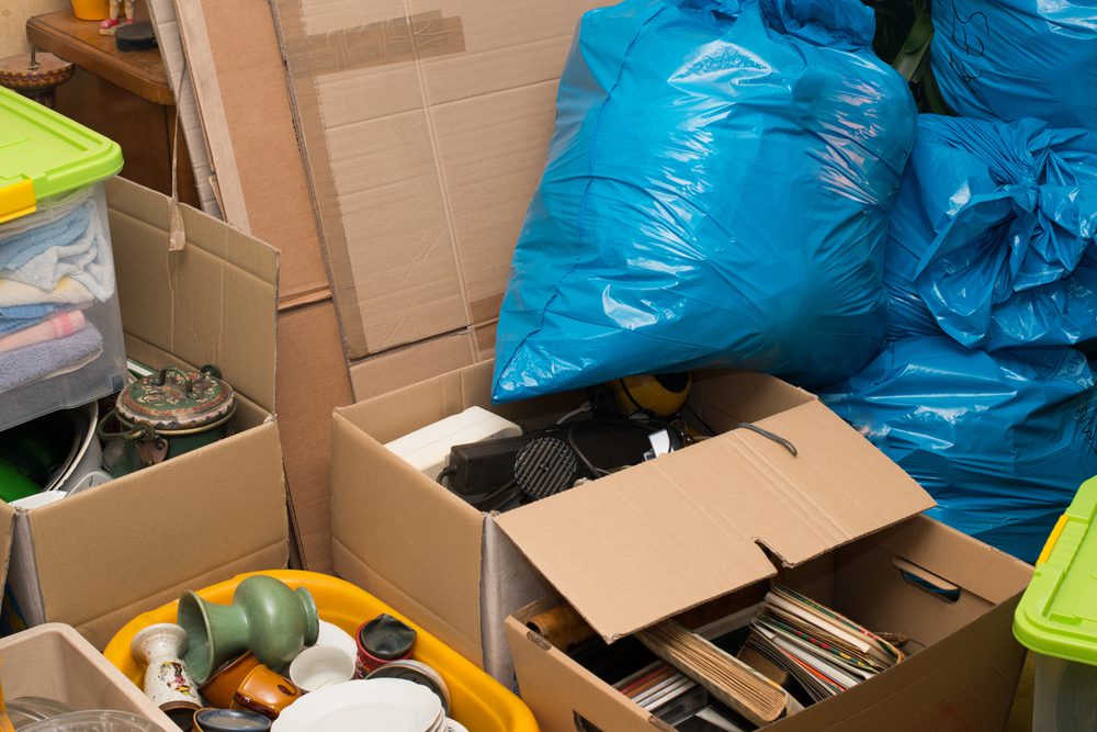 Full cardboard boxes and plastic bags after a house clearing
